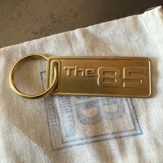 The "THE" Edition brass keychain. 1973 - 1991 Year/Design The 85