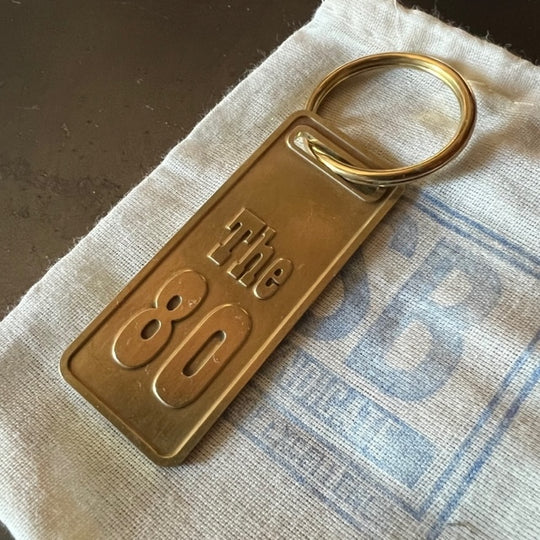 The "THE" Edition brass keychain. 1973 - 1991 Year/Design The 80