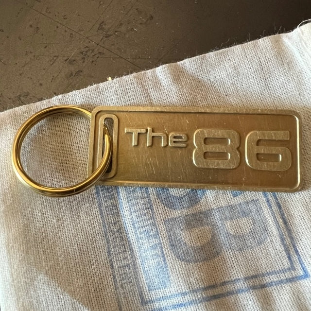 The "THE" Edition brass keychain. 1973 - 1991 Year/Design The 86