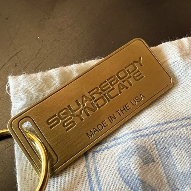 The "THE" Edition brass keychain. 1973 - 1991