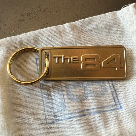 The "THE" Edition brass keychain. 1973 - 1991 Year/Design The 84