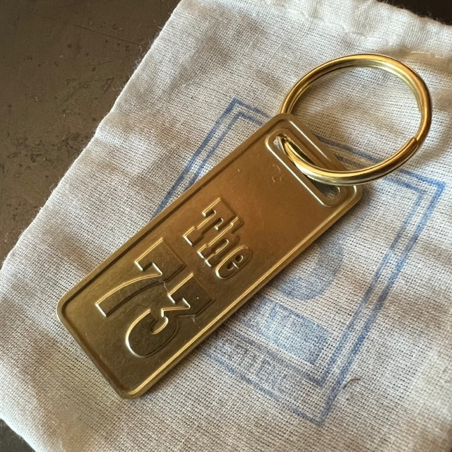 The "THE" Edition brass keychain. 1973 - 1991 Year/Design The 73