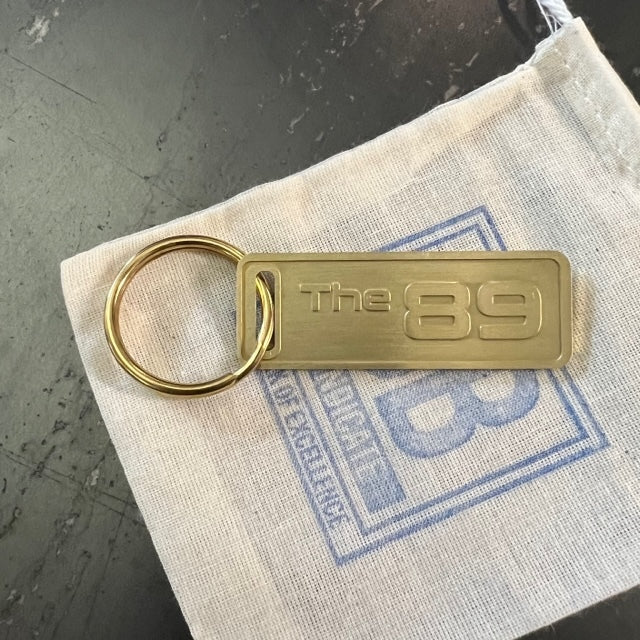 The "THE" Edition brass keychain. 1973 - 1991 Year/Design The 89