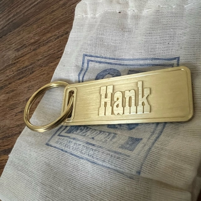 The "THE" Edition brass keychain. 1973 - 1991 Year/Design Hank